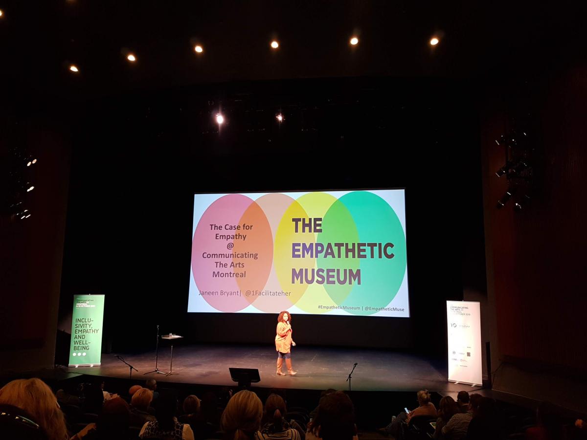 Janeen Bryant speking in front of Empathetic Museum powerpoint